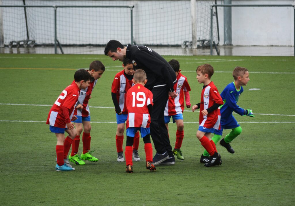 Coach enjoying with children